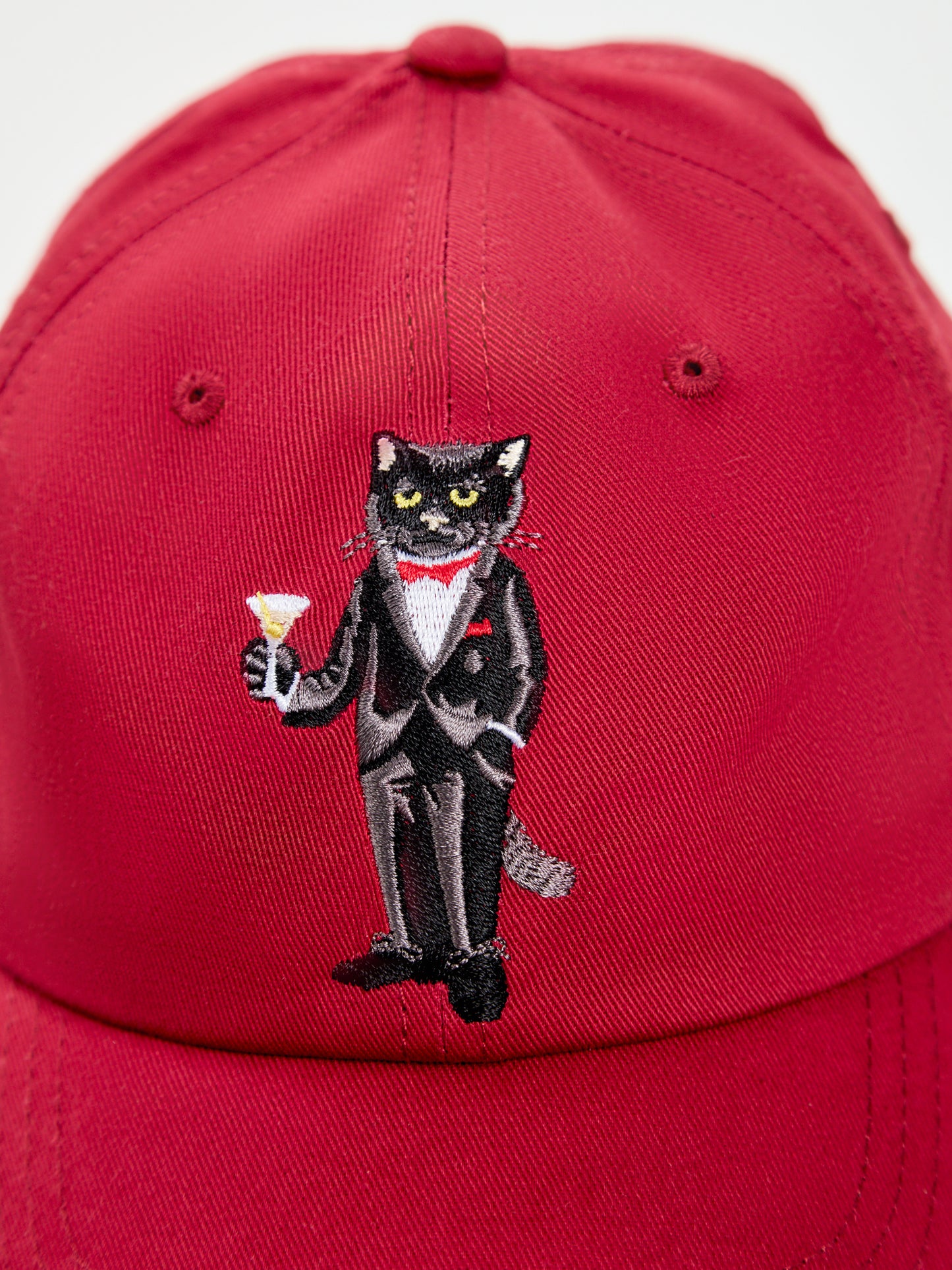 Set: women's white T-shirt with a mini print of a DANDY CAT and a dark red cap with Cat embroidery